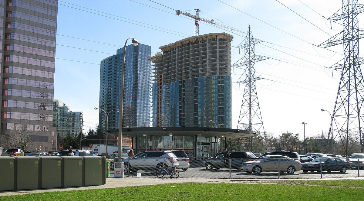 The passenger pick-up area at Finch subway station, with high-rise buildings behind it.