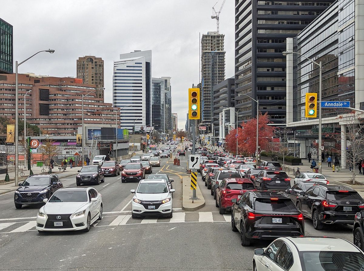 Looking north on Yonge Street at Sheppard Avenue in North York, with condo and office towers on both sides.